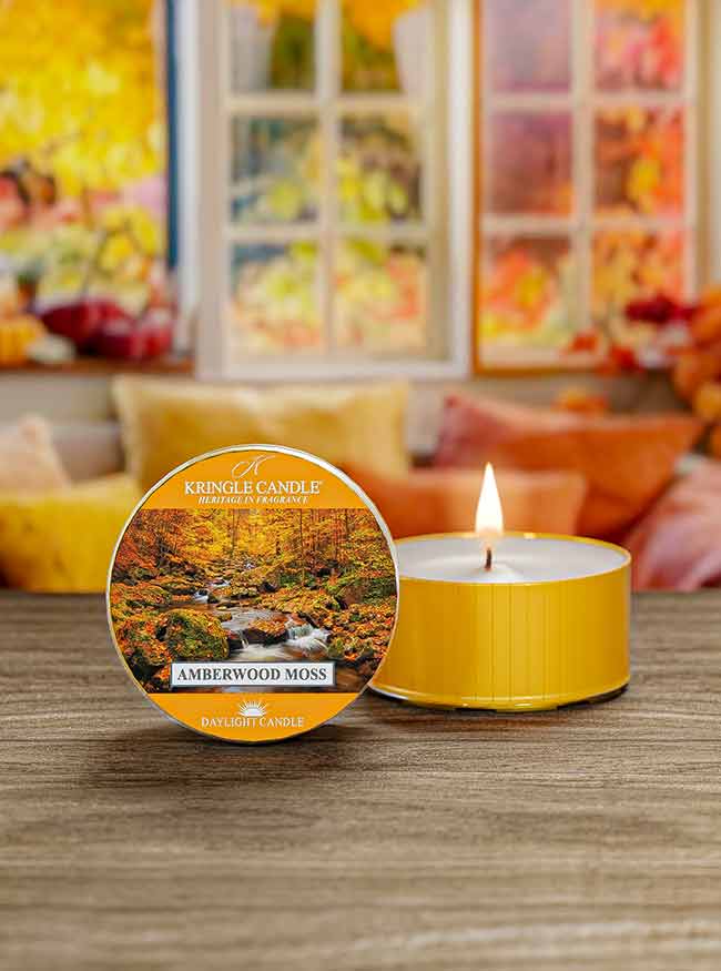Unlit Amberwood Moss DayLight candle with label showing a serene forest stream and autumn foliage.