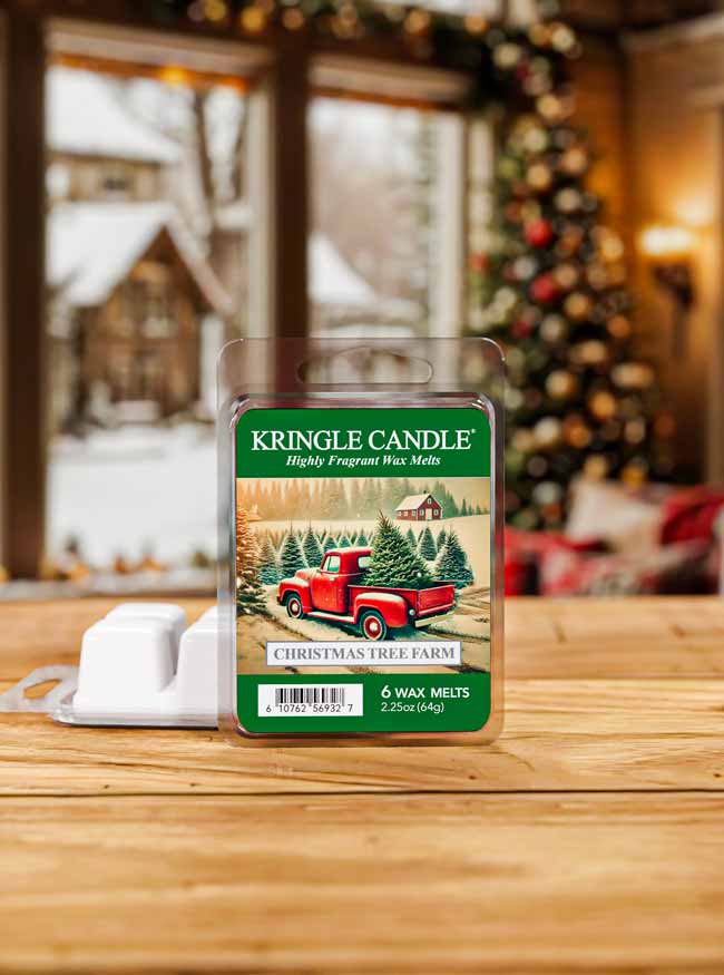 Kringle Candle wax melt package on a wooden surface with a festive background