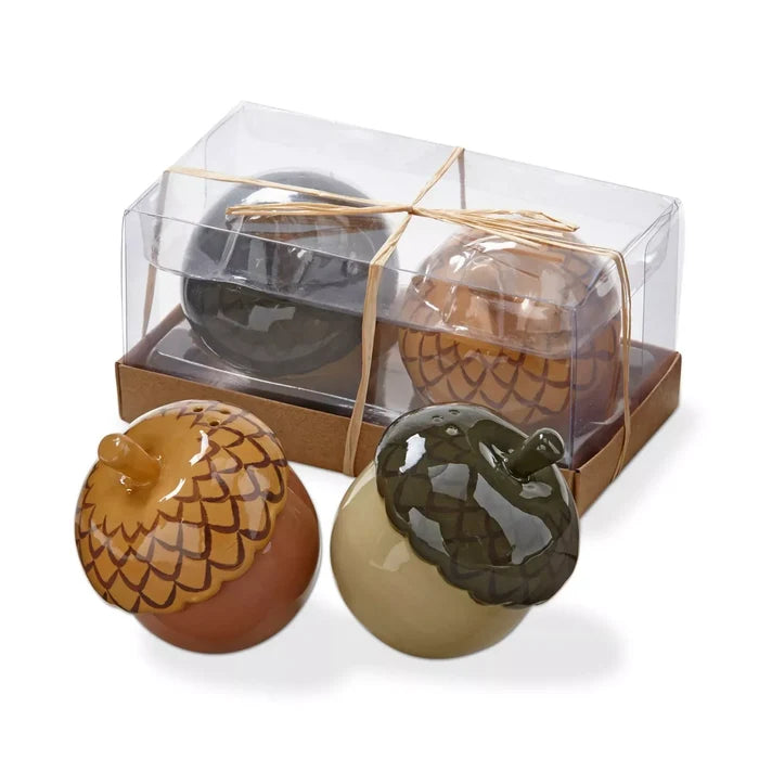 Decorative chocolate spheres with patterned designs packaged in a clear display box.