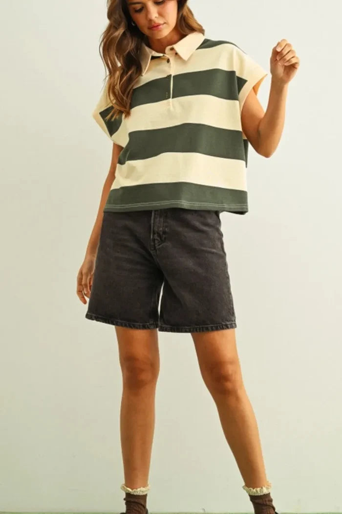 Woman in wide striped short sleeve polo shirt in cream and olive green
