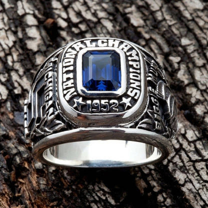 Close-up of the vibrant blue gemstone surrounded by National Champions text