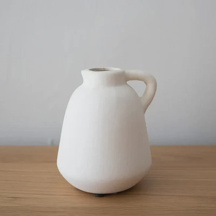 White ceramic jug showcasing the Adanac Stoneware Vase design with a rounded body