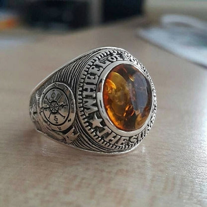 A men's Wheel of Fortune tarot ring, handcrafted from sterling silver and featuring a genuine amber centerpiece.