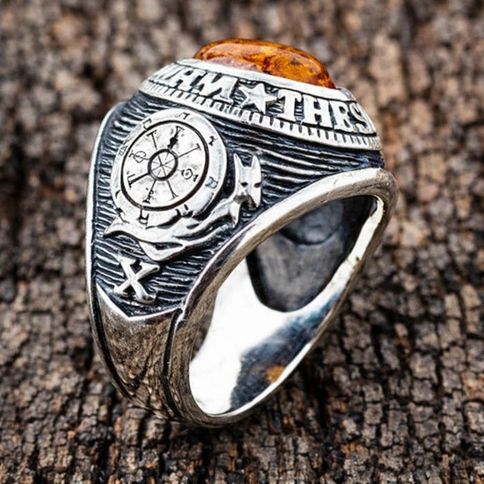 A men's amber ring with mystical symbols from the Tarot, a unique piece of spiritual jewelry.