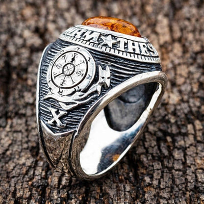 A men's amber ring with mystical symbols from the Tarot, a unique piece of spiritual jewelry.