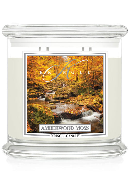 Unlit XL 4-wick candle jar with a label showing a forest scene with a stream and autumn leaves in vibrant orange hues.