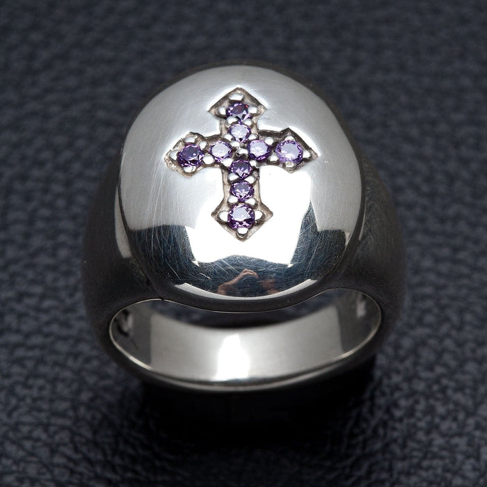 Front view of sterling silver signet ring featuring a budded cross made of purple amethyst CZ stones.