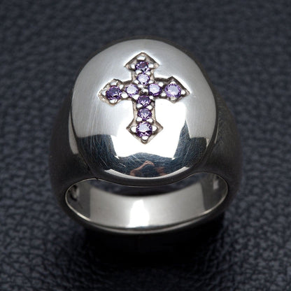 Front view of sterling silver signet ring featuring a budded cross made of purple amethyst CZ stones.