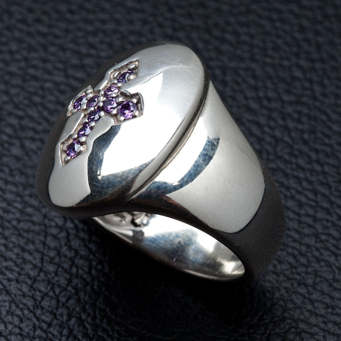 Close-up detail of the amethyst cubic zirconia stones set in a cross shape on a silver bezel.