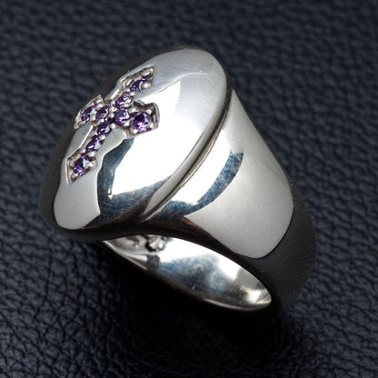 Close-up detail of the amethyst cubic zirconia stones set in a cross shape on a silver bezel.