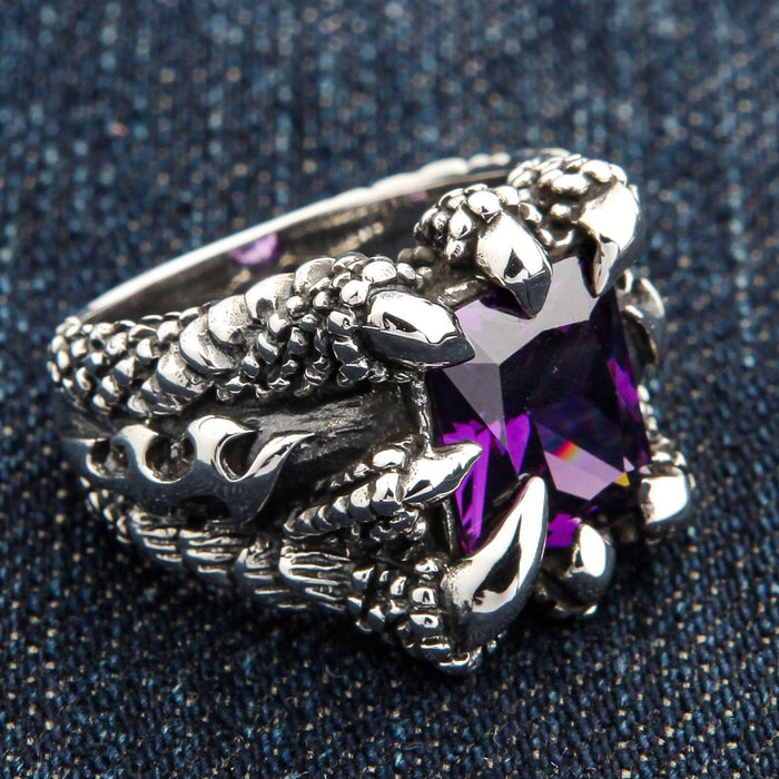 A side profile of the men's eagle claw ring, showing the intricate scaly texture on the band.