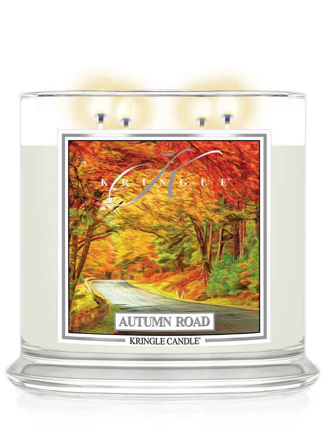 Kringle Candle Autumn Road lit candle with a scenic label on a white background
