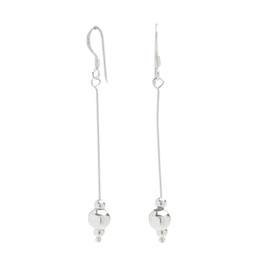 Ballroom Dangle Earrings. Long silver dangles with a couple of artistic silver circles at the end.
