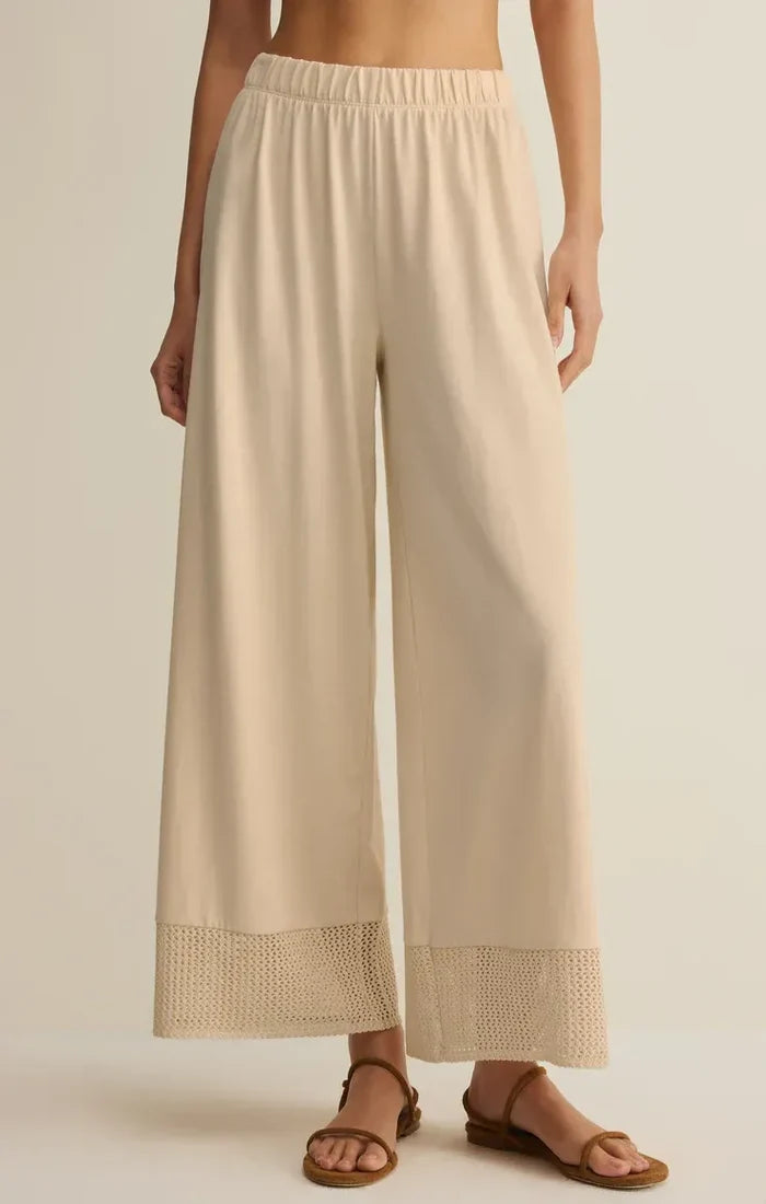 Beige banyan crochet relaxed pants with wide-leg fit soft elastic waistband and delicate lace trim at the hem
