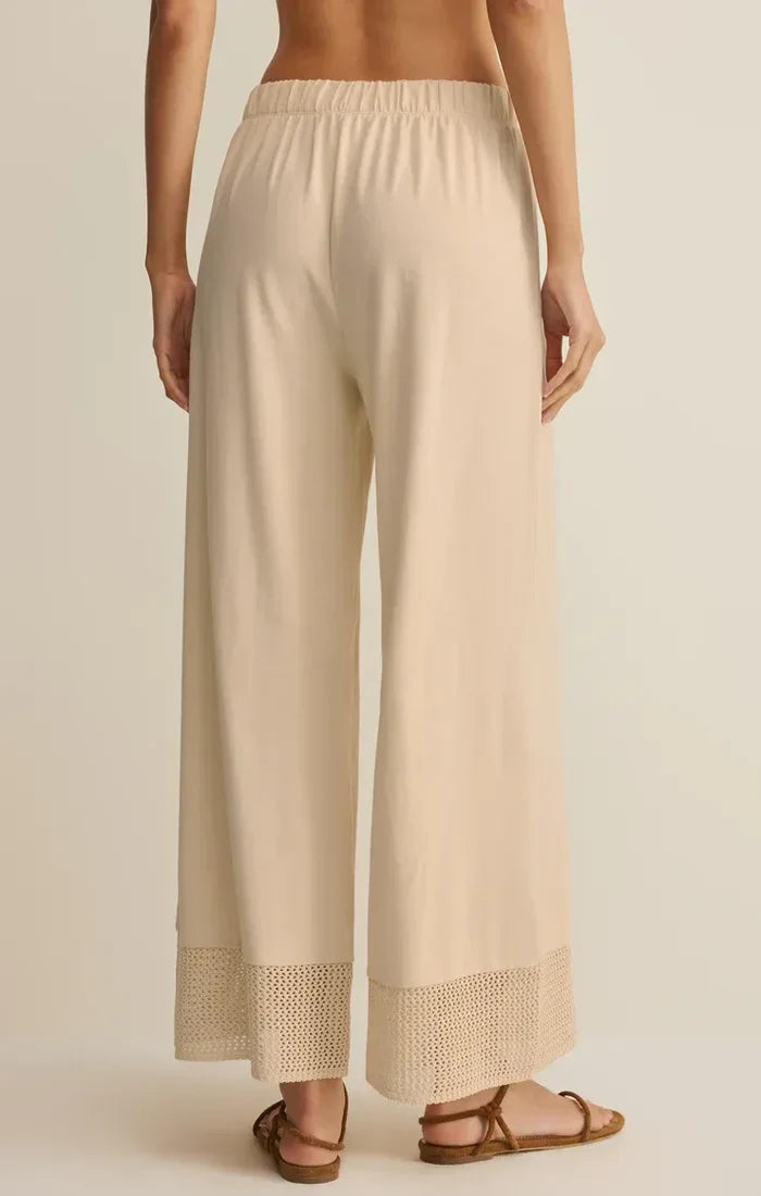 Beige banyan crochet relaxed pants with wide-leg design elastic waistband and delicate lace trim at the hem