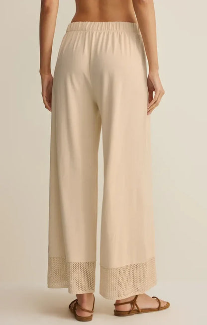 Beige banyan crochet relaxed pants with wide-leg design elastic waistband and delicate lace trim at the hem