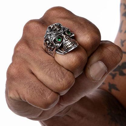 A man wearing the large, ornate baroque skull ring to demonstrate its massive size and scale on the hand.