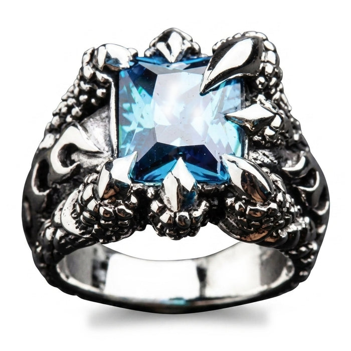Blue topaz set high in four eagle talons on a polished .925 sterling silver ring, shot straight on