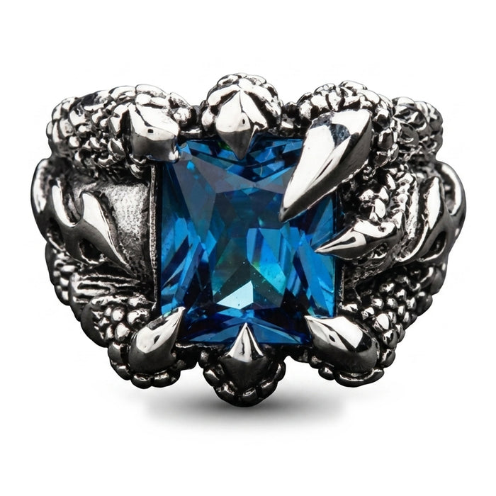 Front view of a blue topaz eagle claw ring, four sterling silver talons gripping a rectangular sky-blue stone