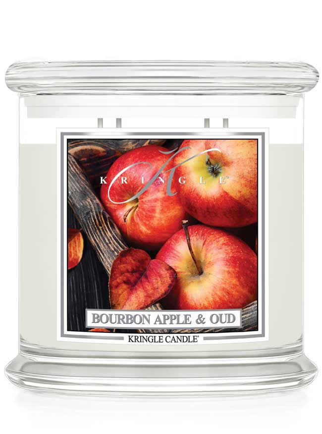 Kringle Candle with 4-wick extra large Bourbon Apple & Oud candle featuring apples on a white background