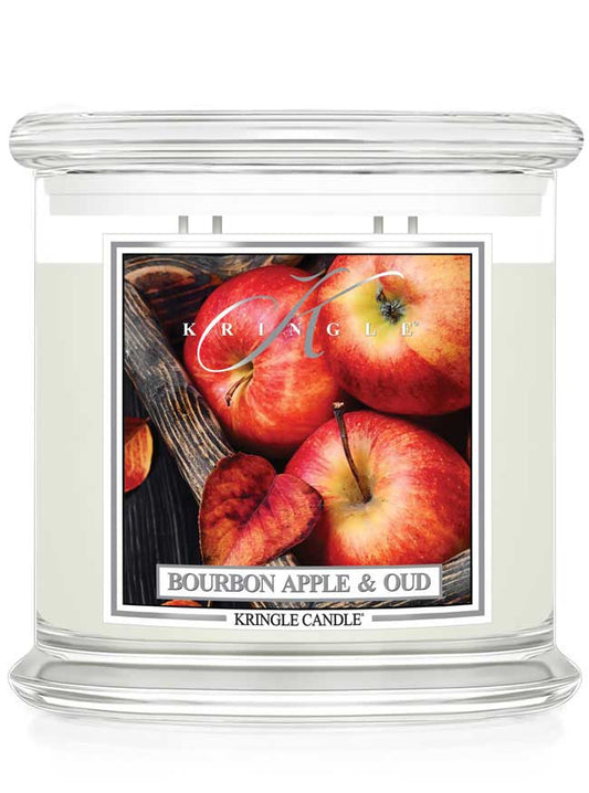 Kringle Candle with 4-wick extra large Bourbon Apple & Oud candle featuring apples on a white background