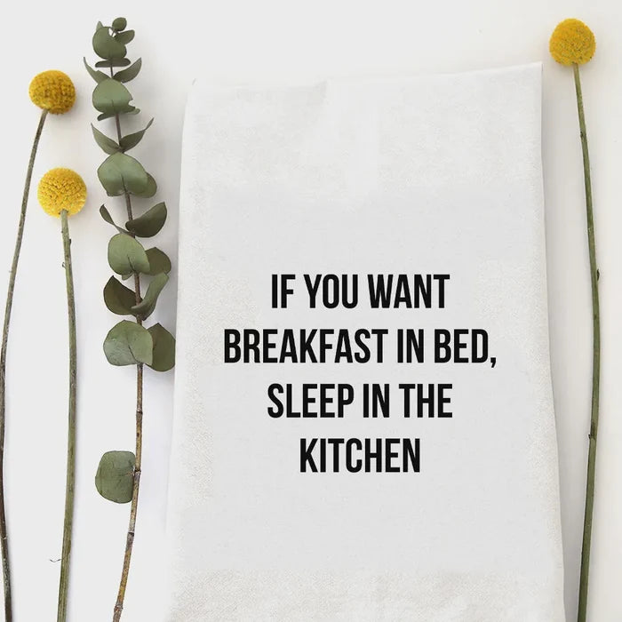White cotton breakfast in bed tea towel with black text if you want breakfast in bed sleep in the kitchen