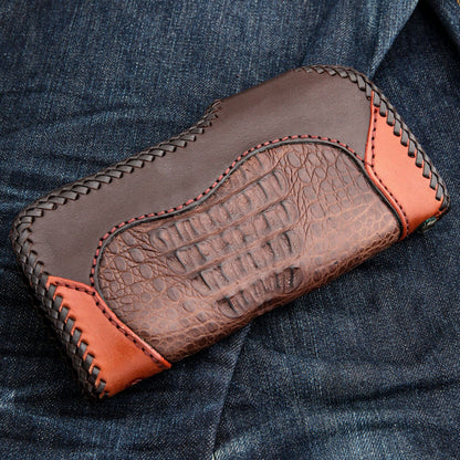 Brown crocodile leather biker wallet with dark brown and orange smooth leather accents, featuring laced edges, presented flat on blue denim
