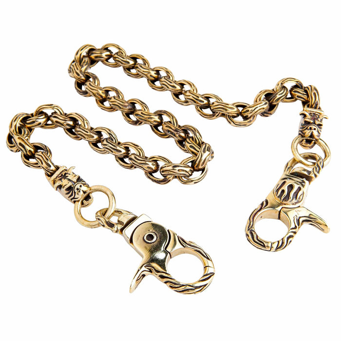 A full view of the brass biker wallet chain, highlighting the intricate bulldog heads and flame clasps.