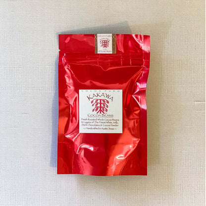 CHOCO COVERED COCOA BEAN 2 OZ an Austin Chocolate by Cocoapuro Kakawa in red packaging.