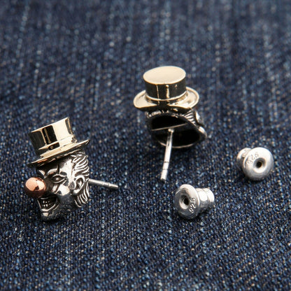 The pair of gothic clown earrings separated to show the post and back individually.