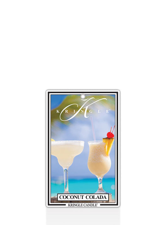 Label with two coconut coladas in glasses against a tropical beach backdrop. Text reads "Coconut Colada" and "Kringle Cand…