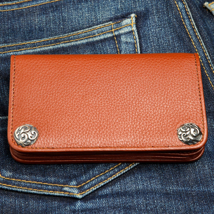 A beautiful, cognac brown leather biker wallet with ornate, solid sterling silver flame-style snaps (conchos).