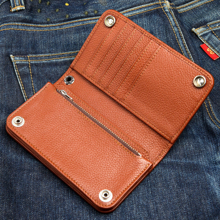 The fully open interior of a long chain wallet in rich brown leather, showing multiple card slots and a secure zipper compartment.