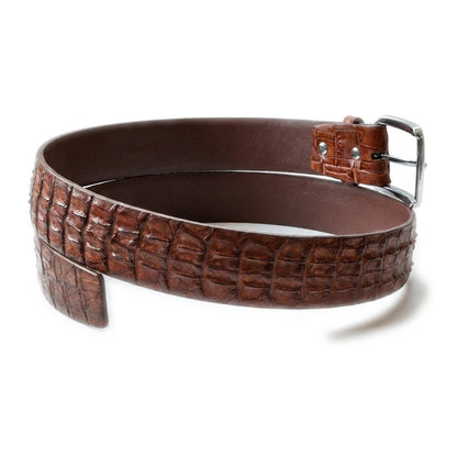 Full loop of the cognac crocodile backbone belt laid flat with the tapered scaled tip end and brown edge