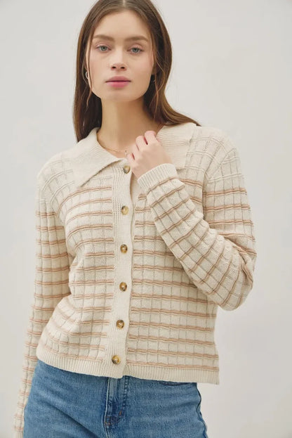 Cream-colored collared striped button up knit cardigan with beige grid and gold buttons