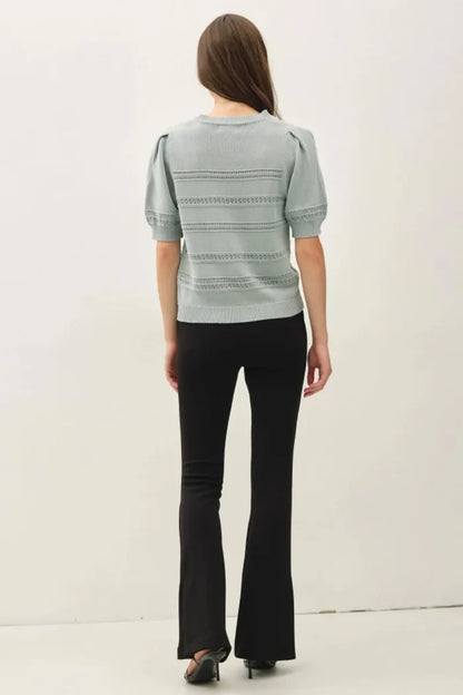 Light gray knitted crochet striped puff sleeve sweater with short puffed sleeves and lace-trimmed horizontal bands