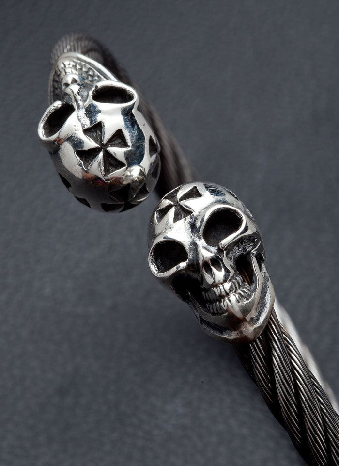 A detailed macro shot of the cross-engraved skull on the biker cuff.