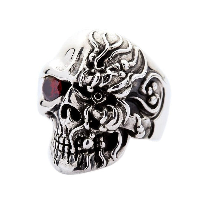 Side angle view of cyborg skull ring showing intricate mechanical plating and ruby eye on white background