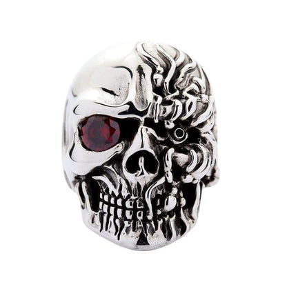 Front view of T-800 inspired sterling silver skull ring with red ruby eye and mechanical detailing