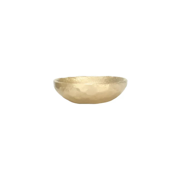 Shallow gold-colored decorative cast aluminum bowl with textured surface for a boho vibe