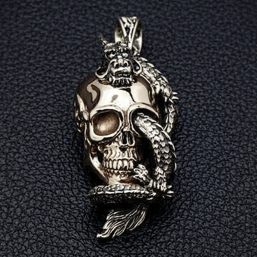 Front view of 925 sterling silver dragon wrapping a brass skull pendant