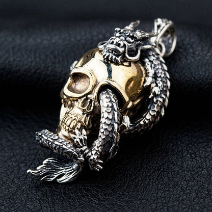 Angled view showing two-tone brass skull and sterling silver dragon details