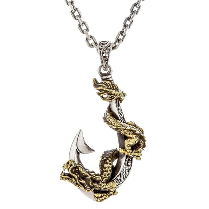 A front view of the sterling silver and brass dragon necklace with a fish hook design.