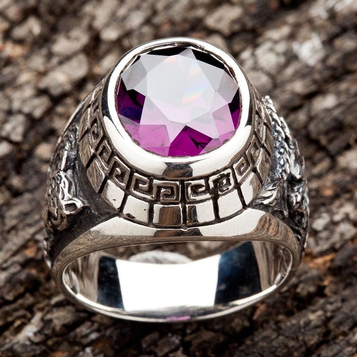 A top-down view of the amethyst dragon tiger ring, showing the Greek Key pattern around the bezel.