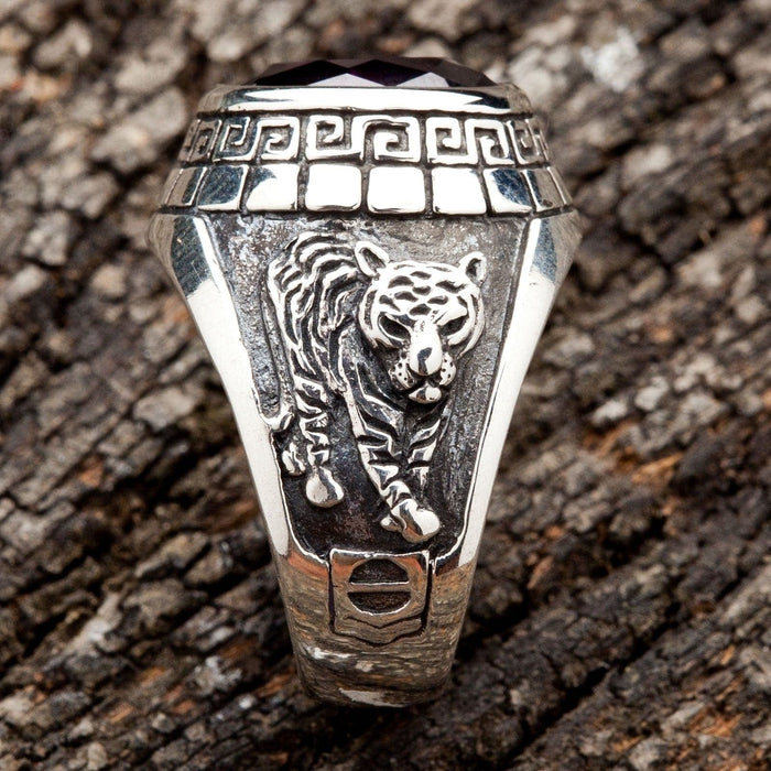 A side view of the men's silver ring showing the detailed carving of a Japanese tiger.