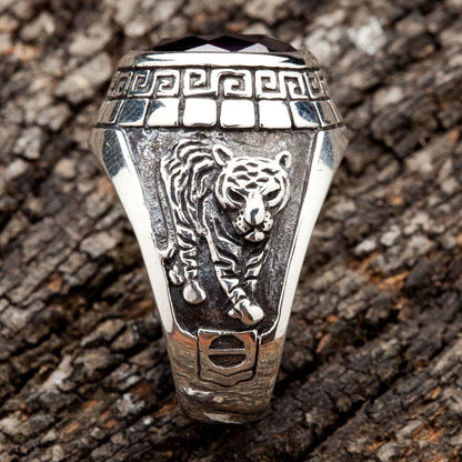 A side view of the men's silver ring showing the detailed carving of a Japanese tiger.