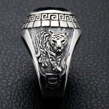 A side view of the men's silver ring showing the detailed carving of a tiger.