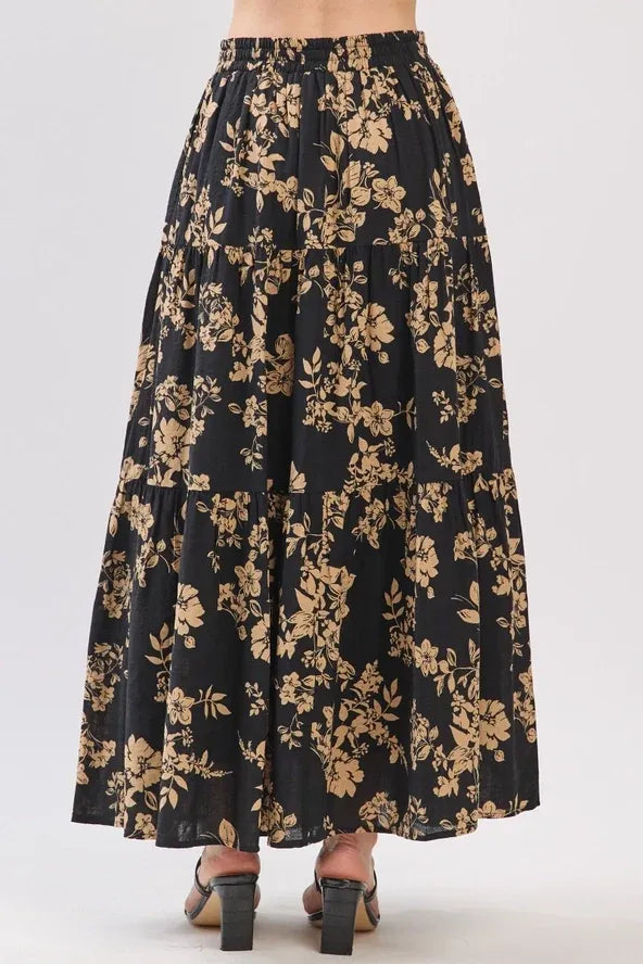 Black floral drawstring tiered midi skirt with gold blossoms and elastic waistband for elegant wear