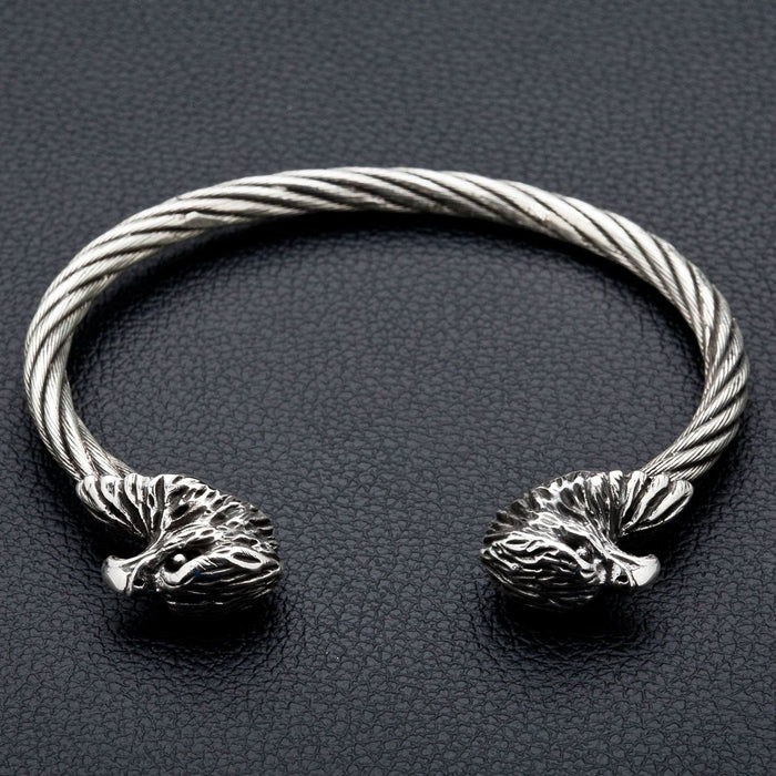 A front view of the men's cuff bracelet, showing the two sterling silver eagle heads and the twisted steel band.