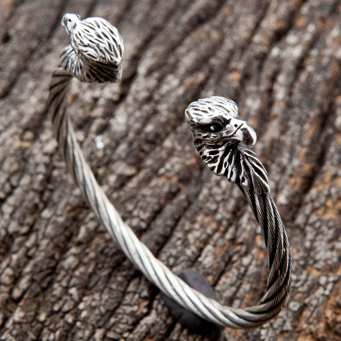 An angled view of the gothic eagle head cuff, highlighting the detailed silver craftsmanship.